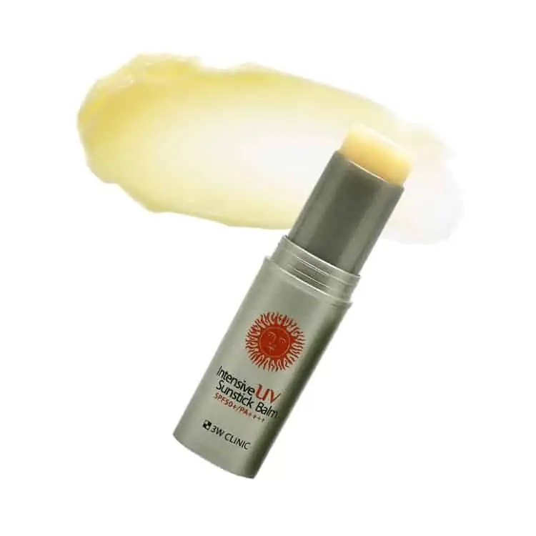 Hand applying 3W Clinic Intensive UV Sunstick Balm directly onto skin for easy sun protection. - thumbnail