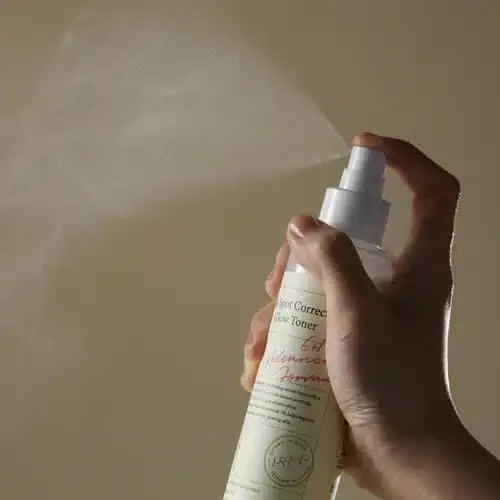 Axis-y Dark Spot Correcting Glow Toner 125ml clear bottle lying horizontally, showcasing label details. - thumbnail