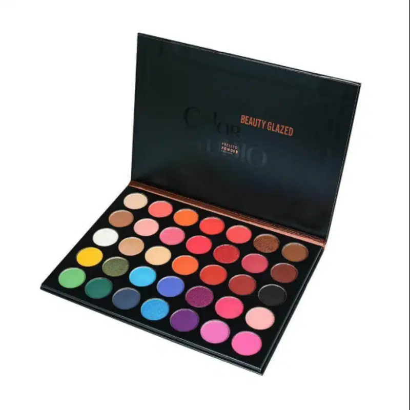 Beauty Glazed Color Studio eyeshadow palette, sleek black matte packaging, clear top view.