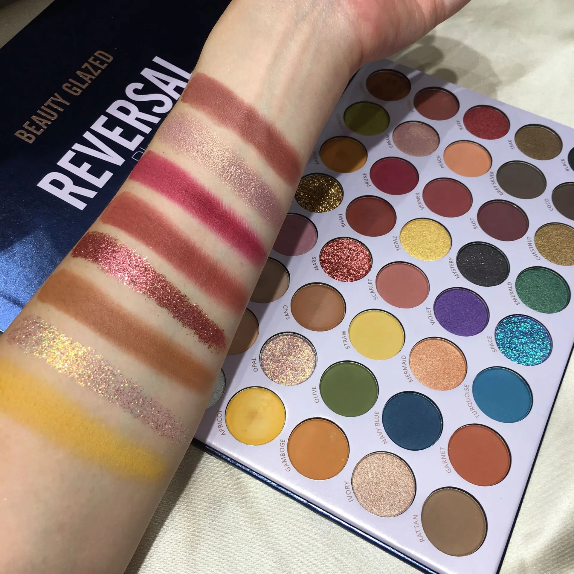 Open Beauty Glazed Reversal Planet eyeshadow palette revealing sixteen vibrant, cosmic shimmery and matte shades. - thumbnail