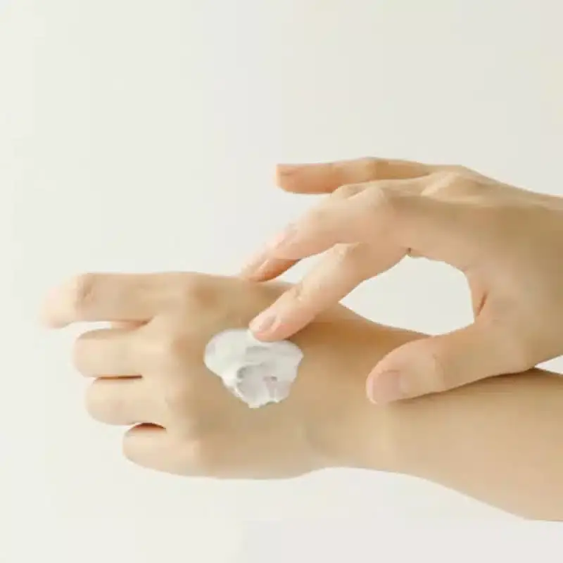 Two white Beauty Of Joseon Relief Sun Rice+Probiotics tubes, one standing, one lying horizontally. - thumbnail