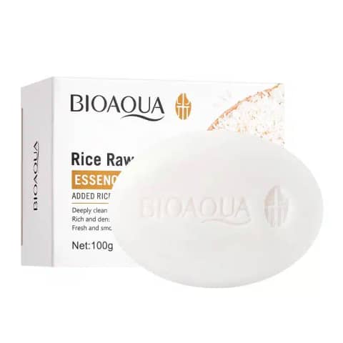 Bioaqua Rice Essence Soap bar, creamy white, partially unwrapped with scattered rice grains for oil control.