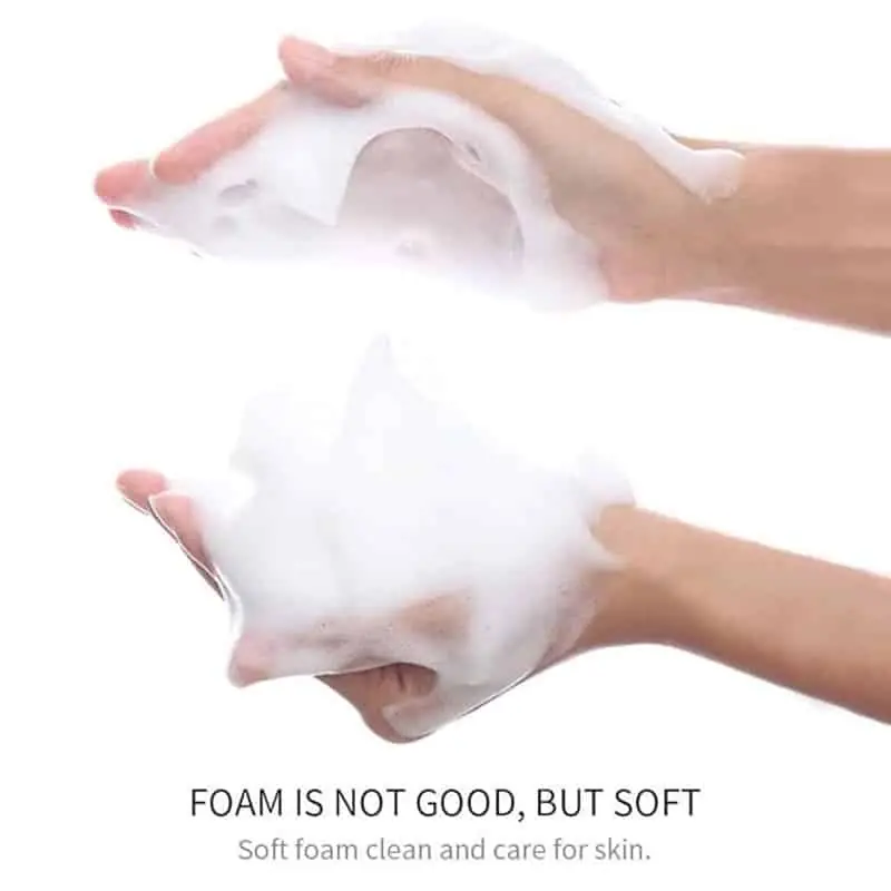 Generous amount of creamy white Bioaqua Rice Raw Pulp Cleanser squeezed onto a hand, showing texture. - thumbnail