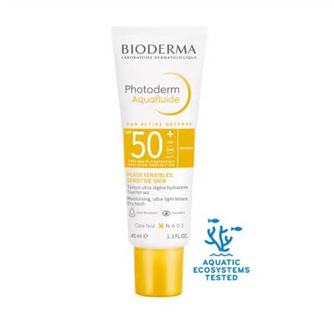 Bioderma Photoderm Aquafluide SPF 50+ sunscreen bottle, white with an orange cap, standing upright.