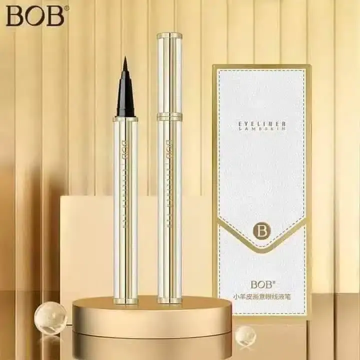 Bob Liquid Eyeliner tube open, revealing its precise, fine-tipped brush applicator horizontally. - thumbnail