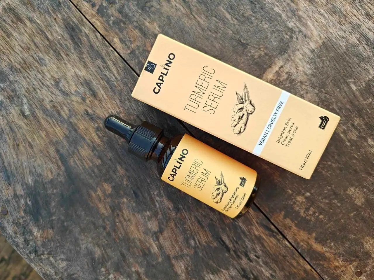 Caplino Turmeric & Vitamin C Serums with vibrant yellow and clear product drops. - thumbnail