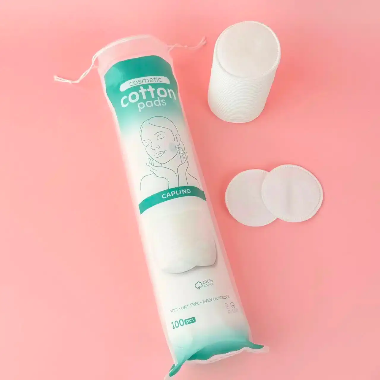 Stack of soft Caplino pure cotton pads, one pulled out, showing texture. - thumbnail