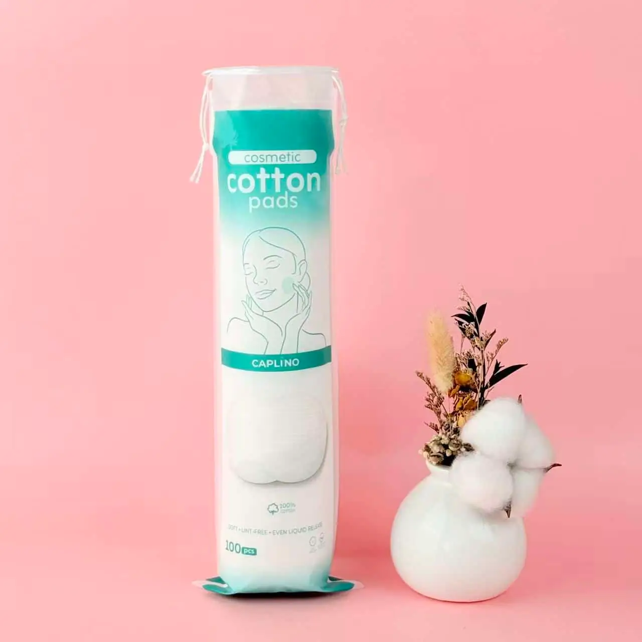 Close-up of a single Caplino lint-free white cosmetic cotton pad, natural texture visible. - thumbnail