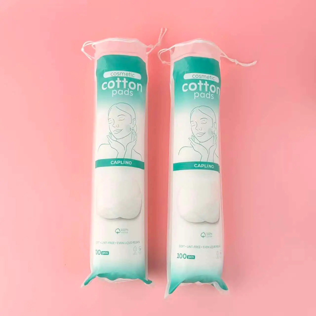 Multiple round Caplino white cotton pads scattered on a clean white background. - thumbnail