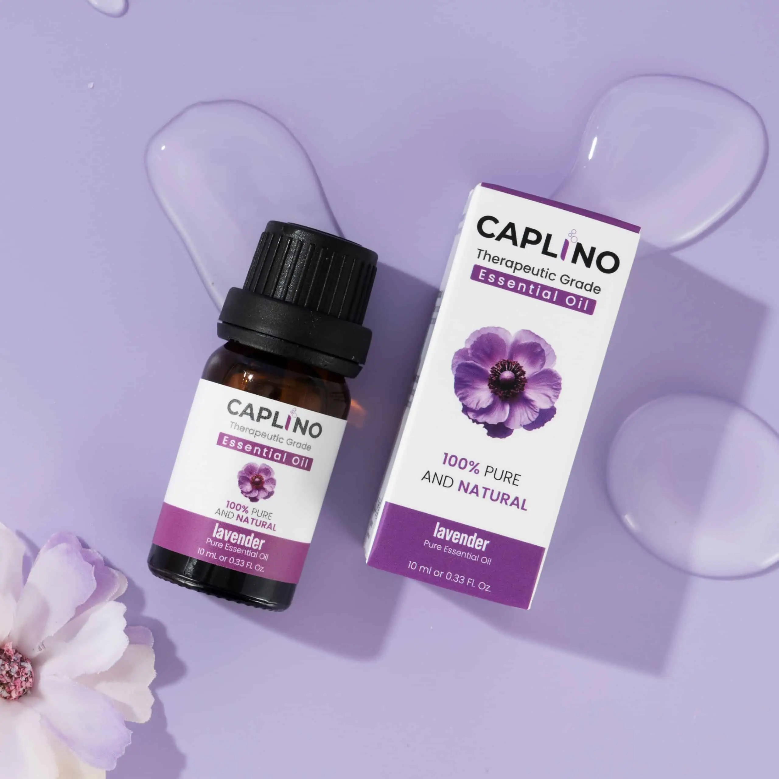 Caplino 10ml lavender essential oil bottle surrounded by vibrant fresh purple lavender blossoms. - thumbnail