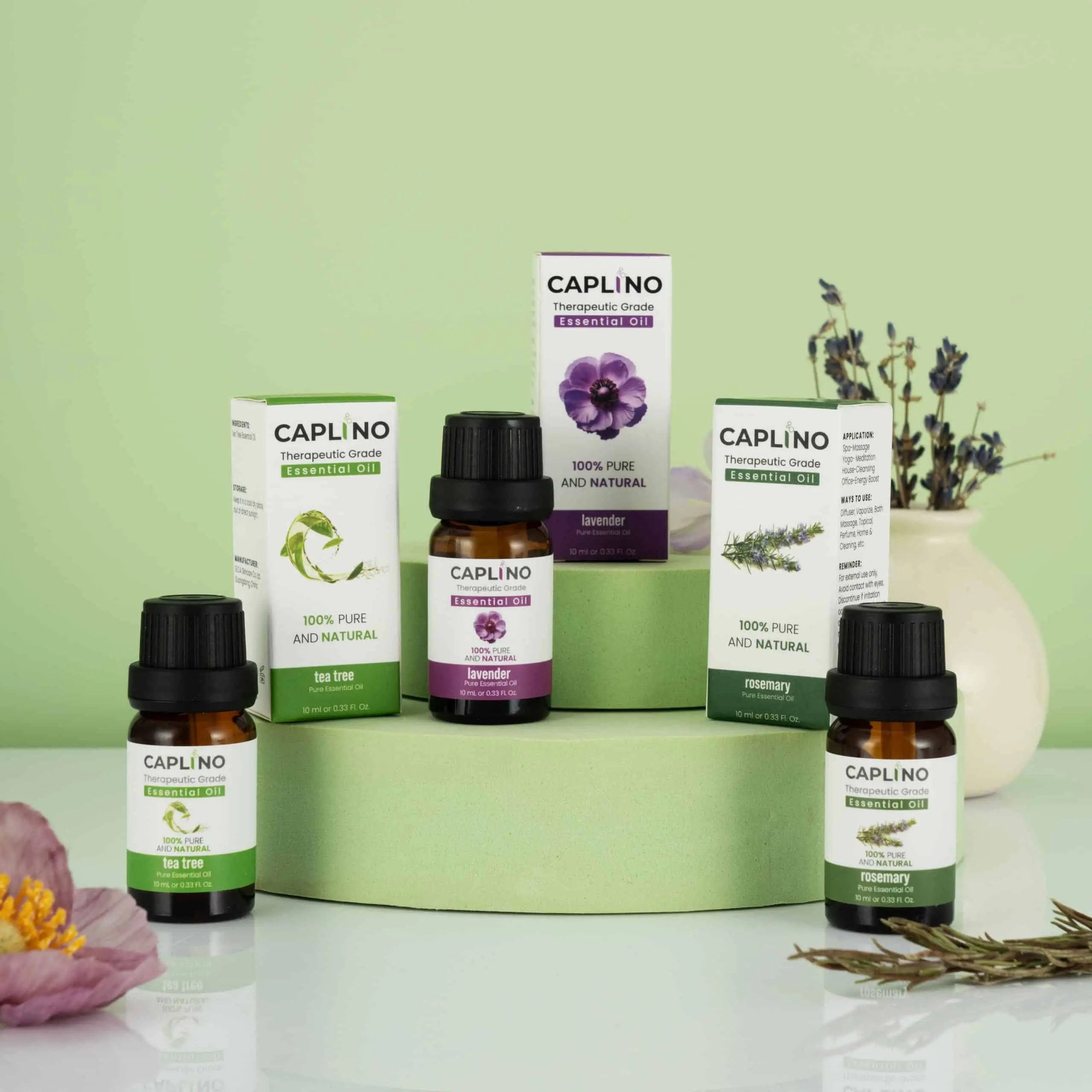 A hand gently holds the Caplino 10ml lavender essential oil bottle outdoors, blurred background. - thumbnail