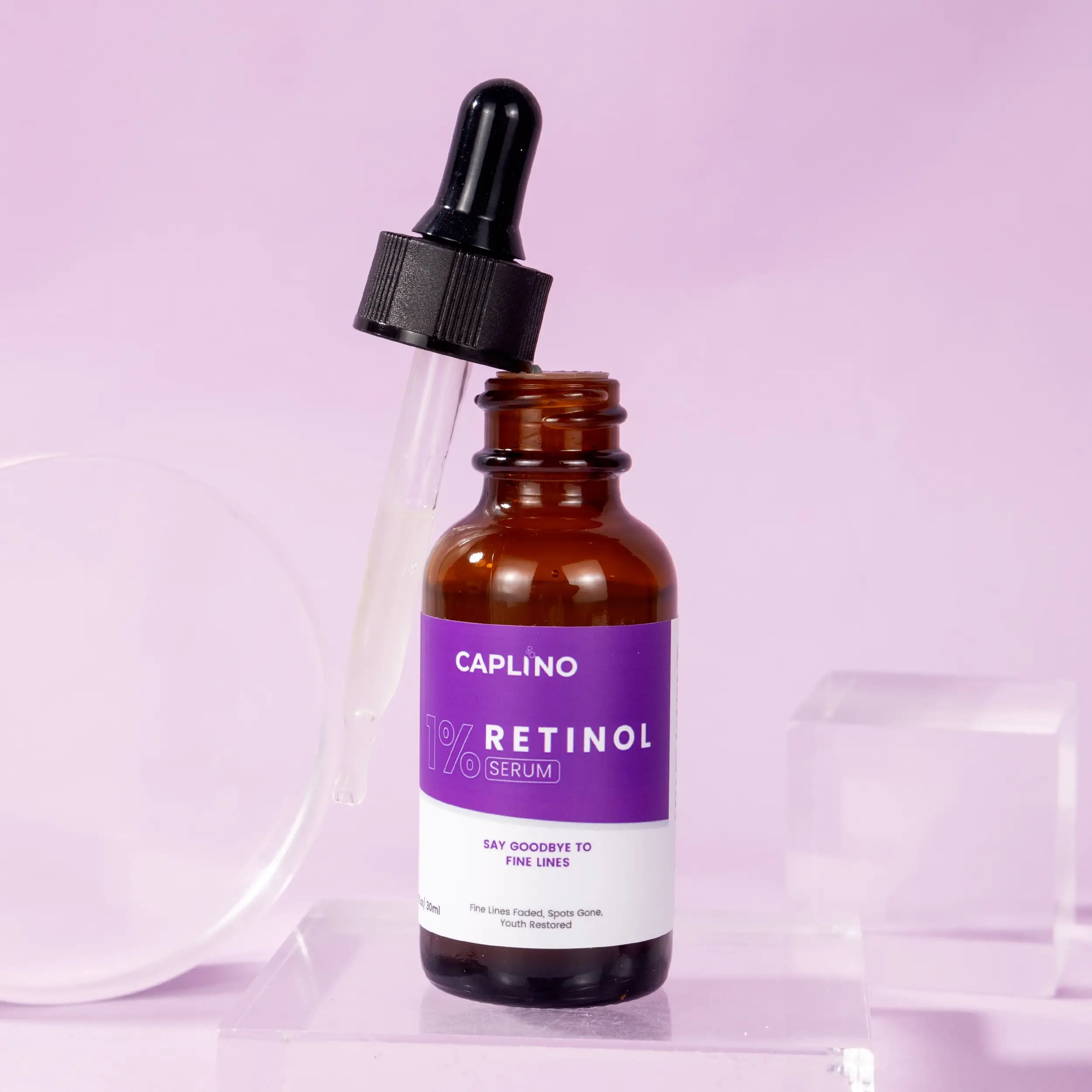 Close-up of Caplino 1% Retinol Serum dropper, with clear serum visible inside. - thumbnail