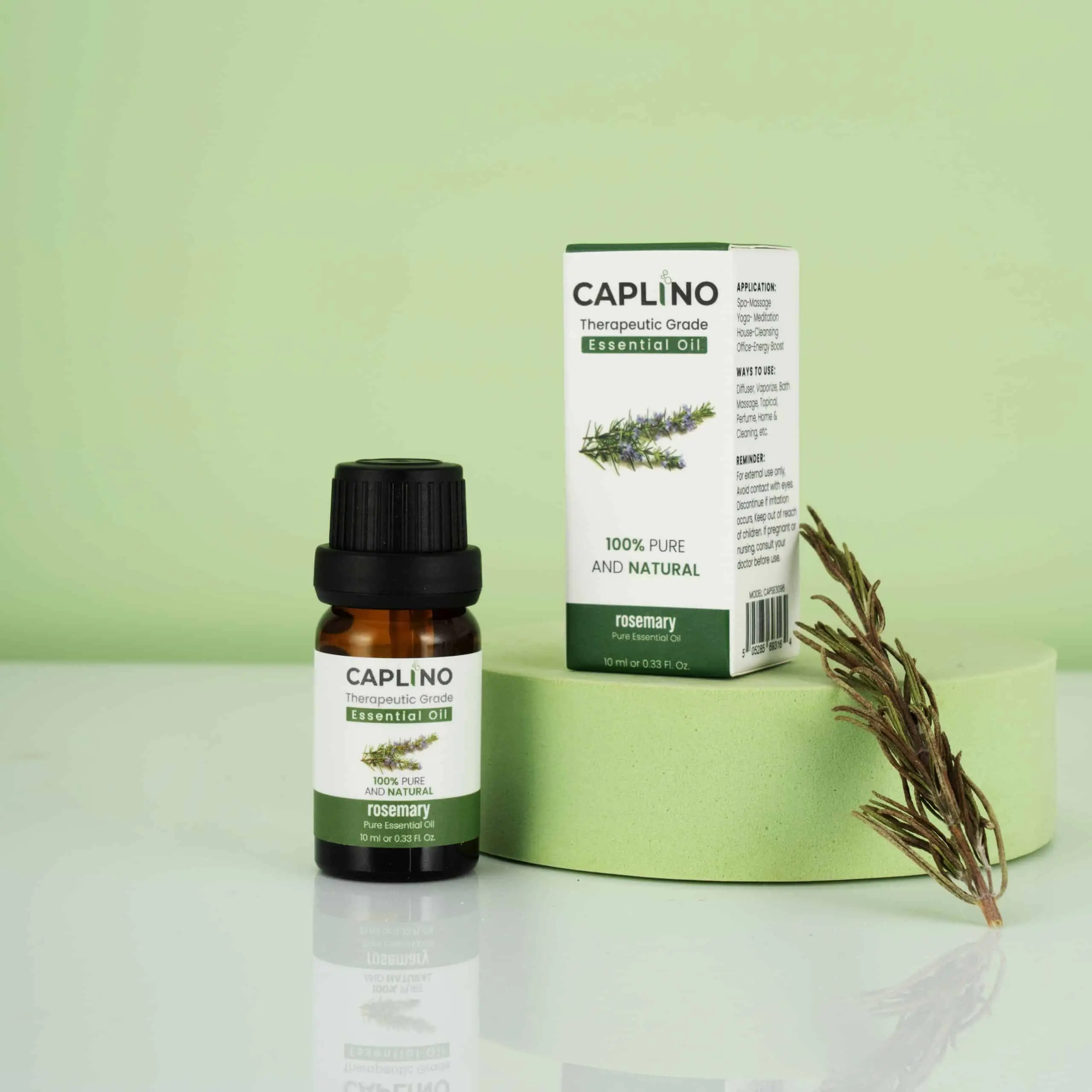 Caplino Rosemary Essential Oil amber glass bottle, slightly tilted with clear product label. - thumbnail