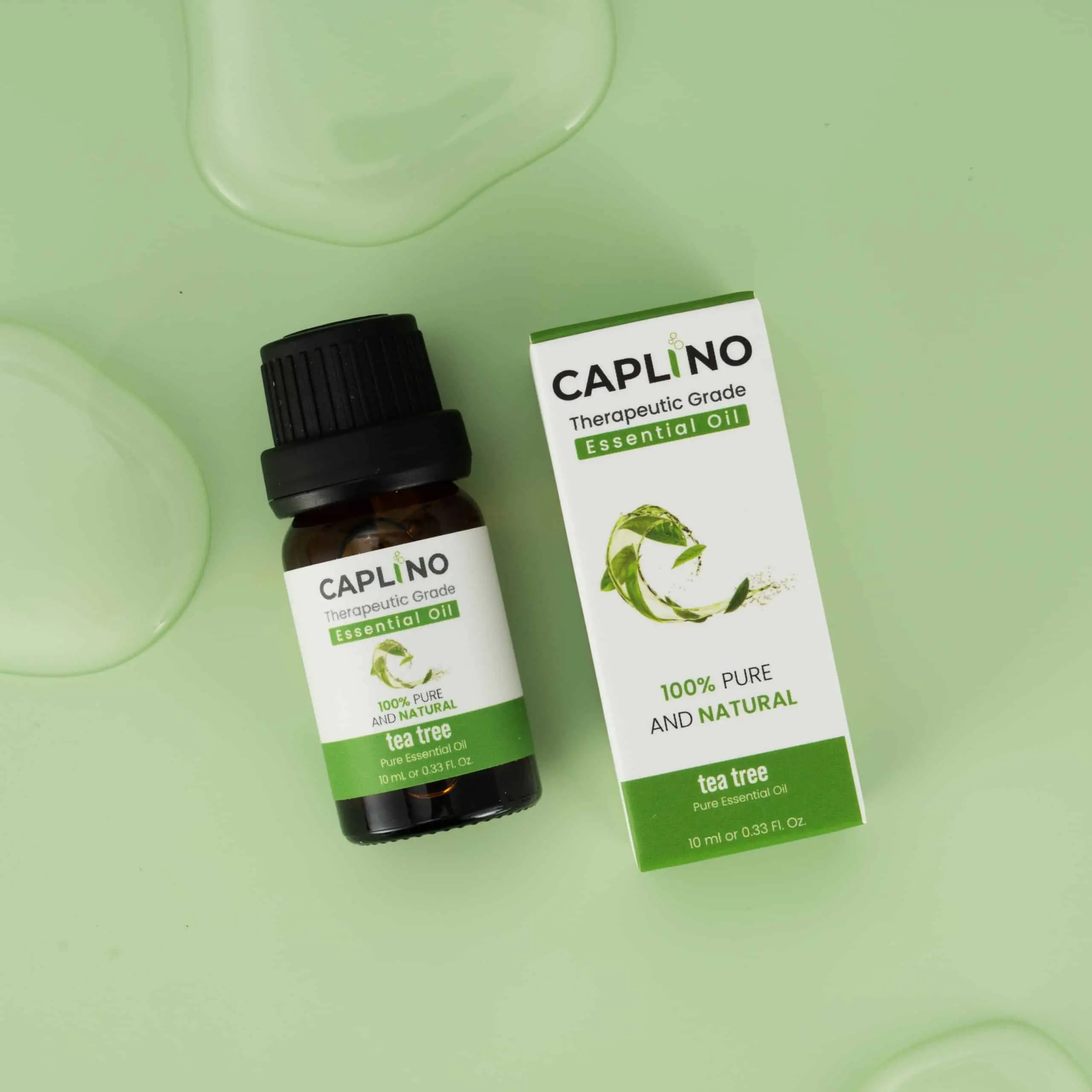 Caplino tea tree essential oil bottle with glass dropper pulled out, ready for use. - thumbnail