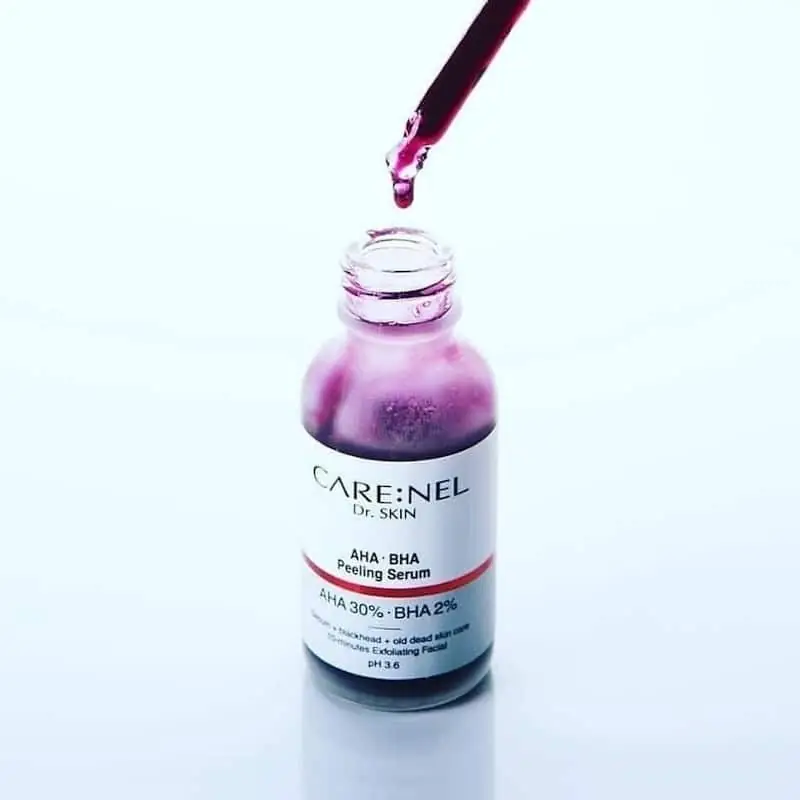 Close-up of Carenel AHA BHA Peeling Serum bottle with the white dropper visibly lifted. - thumbnail