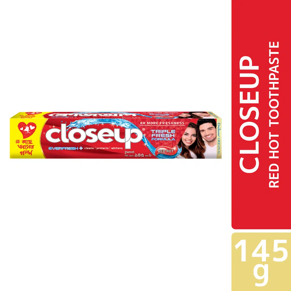 Closeup Red Hot toothpaste tube, 145g, vibrant red packaging with white stripe, standing upright. - thumbnail