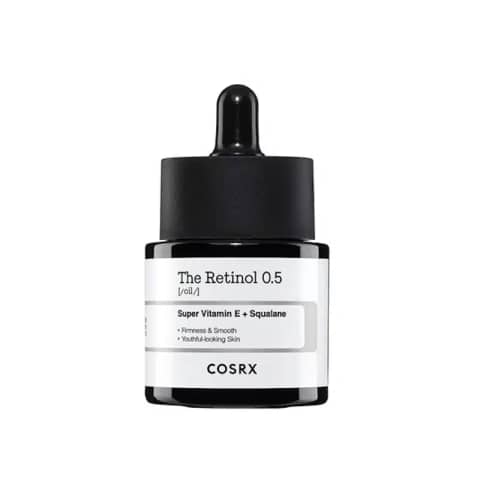 Cosrx The Retinol 0.5 Oil in an amber glass dropper bottle with prominent white label.