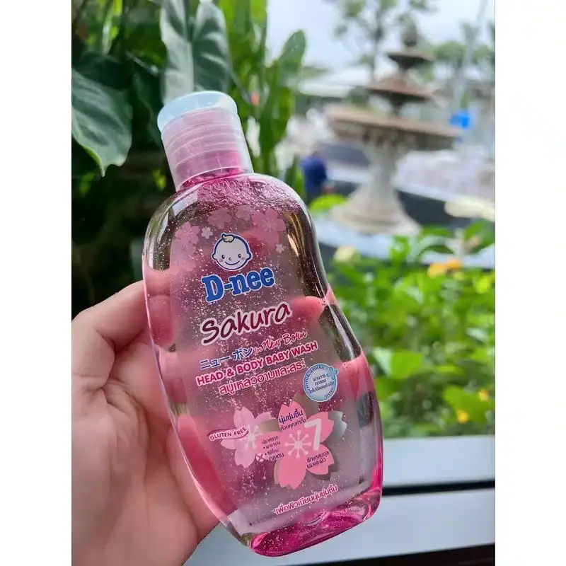 Two D Nee New Born Sakura Shower Gel 200ml white pump bottles displayed side-by-side. - thumbnail