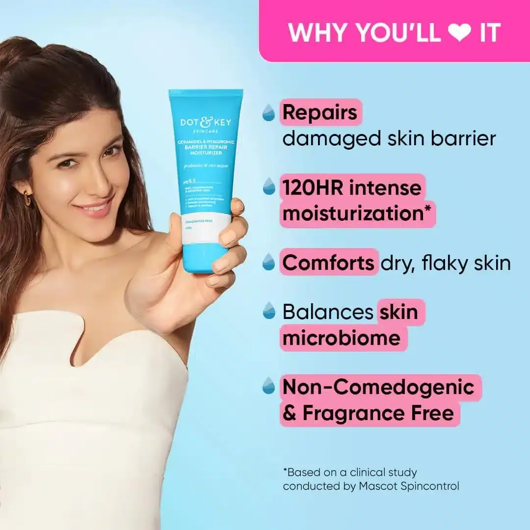 Close-up of creamy Dot & Key moisturizer being scooped from its white tub, showing texture. - thumbnail