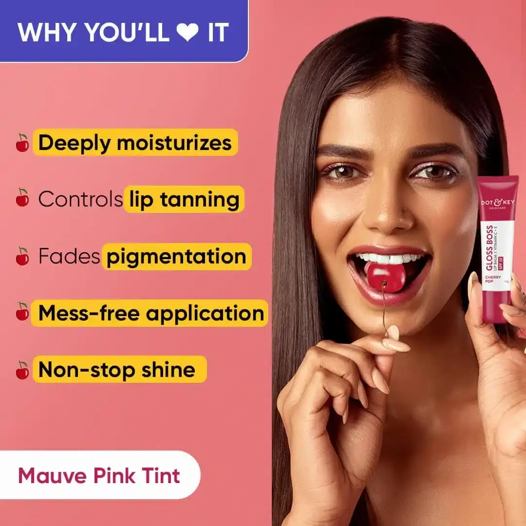 Hand applying Dot & Key Cherry Pop Vitamin C+E SPF 30 lip balm. - thumbnail