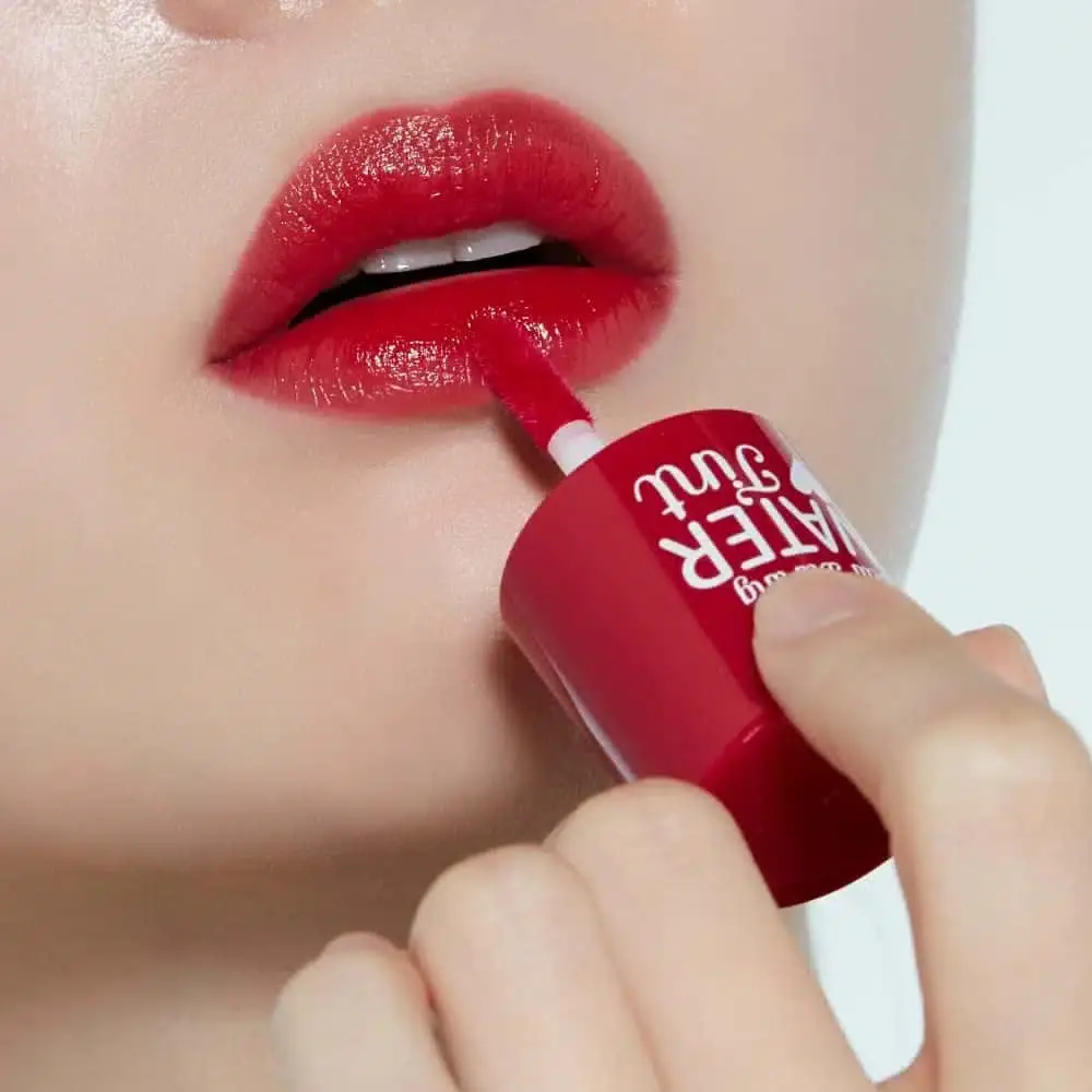 Etude Dear Darling Water Tint 02 Cherry Ade bottle with removed applicator wand revealing tint. - thumbnail