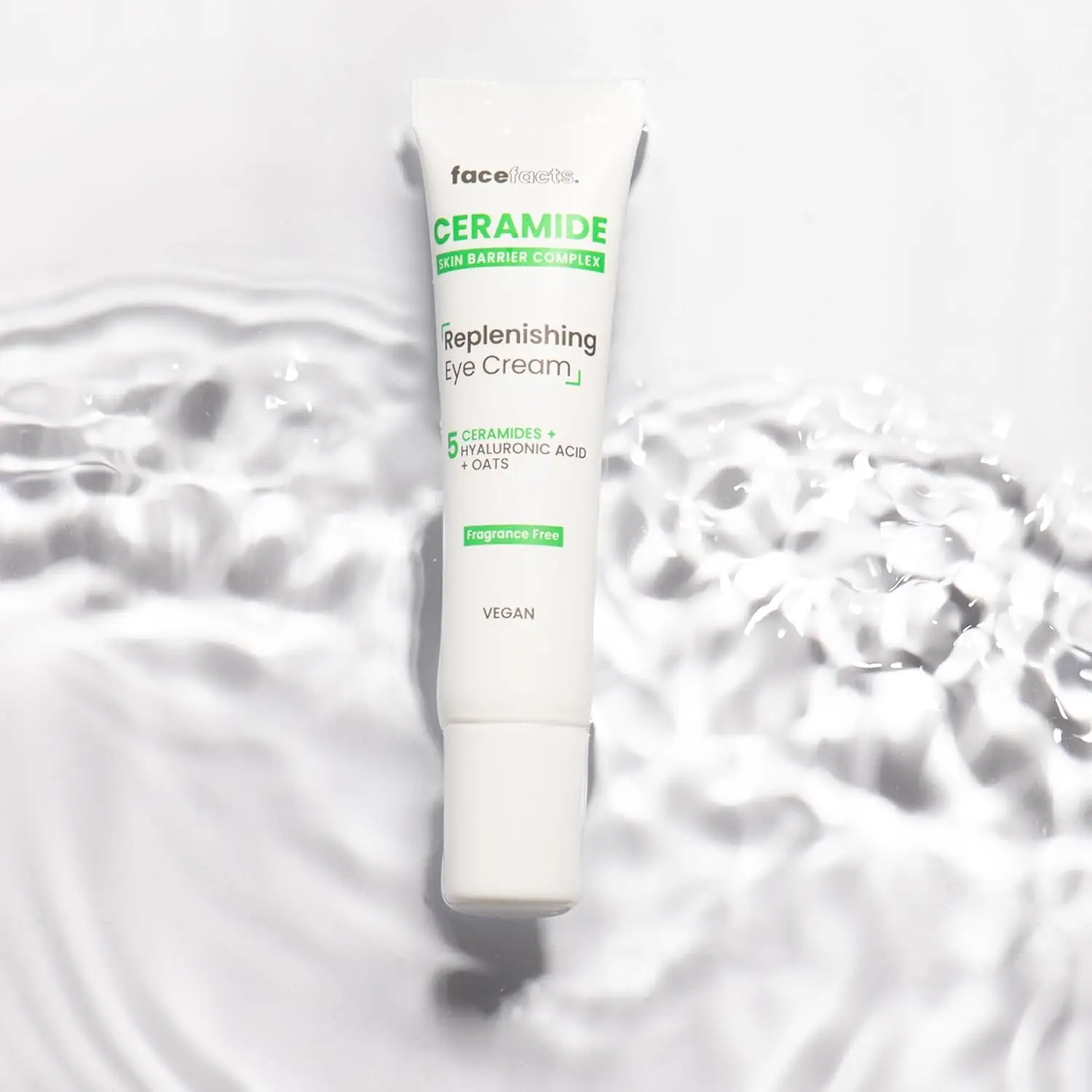 Hand gently applying a dollop of Face Facts Ceramide skincare cream onto another hand for demonstration. - thumbnail