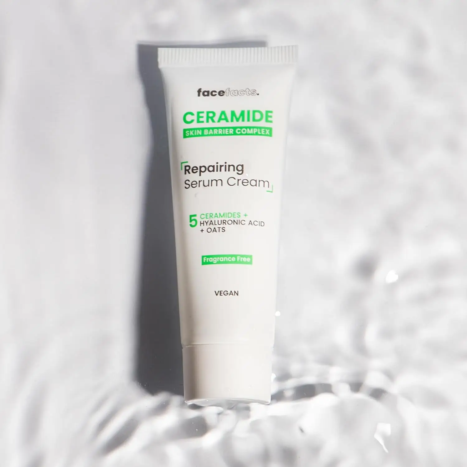 Close-up of Face Facts Ceramide cleanser, serum, day, and night cream packaging details and labels. - thumbnail