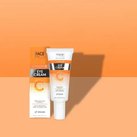 Face Facts Vitamin C Brightening Eye Cream, white tube with orange cap, front view.
