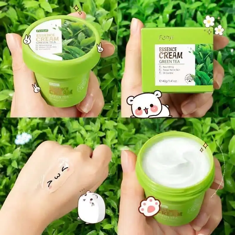 Open Fenyi Green Tea Essence Cream jar revealing smooth white texture and applicator scoop. - thumbnail