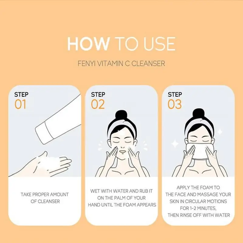 Fenyi Vitamin C Cleanser tube flat, beside a small bowl of rich white lather on wood. - thumbnail