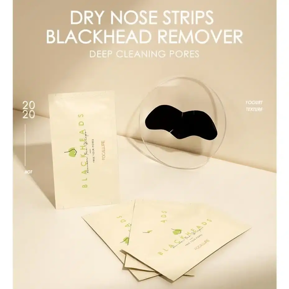 A hand holding a single Focallure Blackhead Remover Nose Strip sachet diagonally. - thumbnail