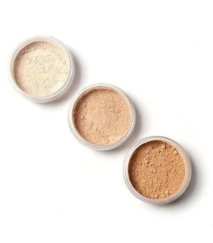 Focallure Loose Powder Fa15 container tilted, with fine light beige powder spilled on a surface. - thumbnail
