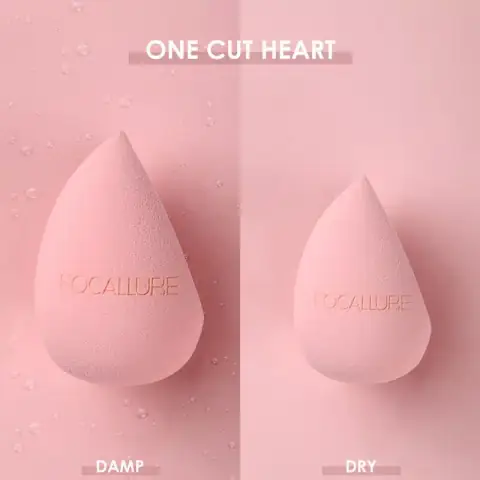 Two Focallure Match Max pink makeup sponges, teardrop shape with a slanted flat edge, angled display.