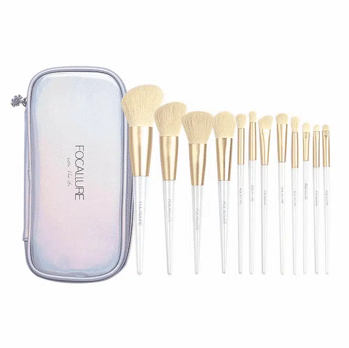 Focallure Snow Elf 12-piece professional makeup brush set featuring elegant white handles and soft light bristles, neatly laid out.