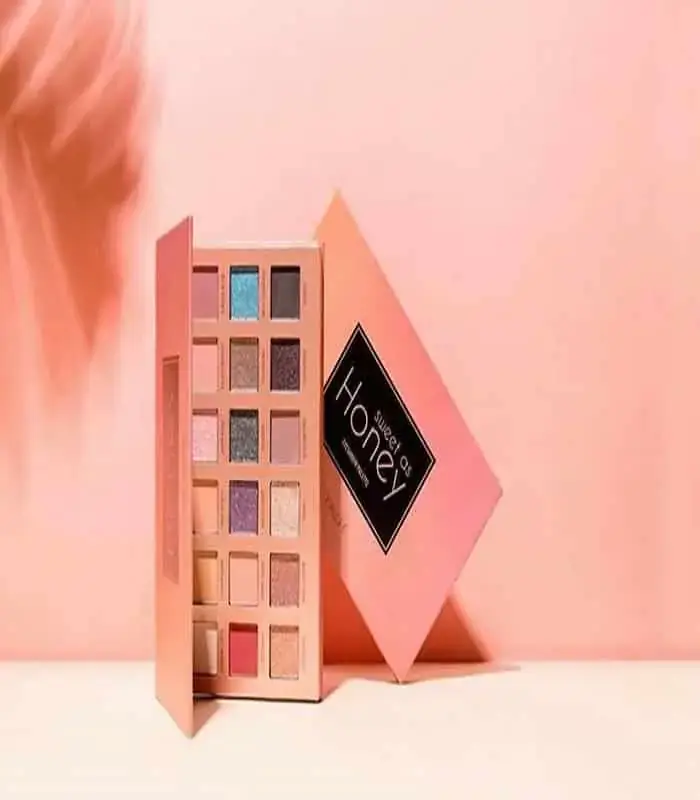 Focallure Sweet As Honey eyeshadow palette closed, displaying its textured golden honeycomb packaging on a white surface. - thumbnail