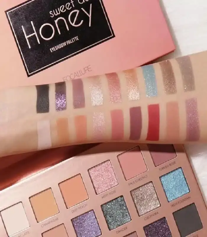 Focallure Sweet As Honey eyeshadow palette open, showing 9 warm shades and golden compact from an angle. - thumbnail