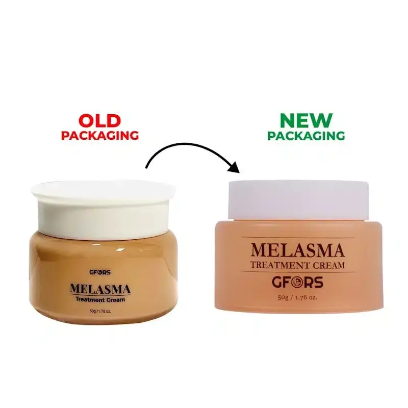 Open GFORS Melasma Treatment Cream jar with a spatula holding a dollop of smooth white cream. - thumbnail