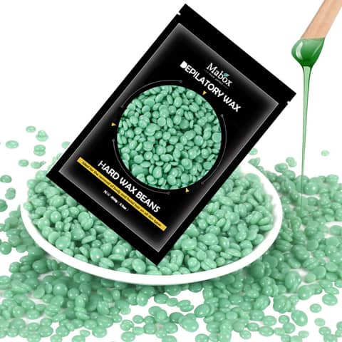 Mabox pink wax beans in clear packaging with scattered beads for female hair removal.