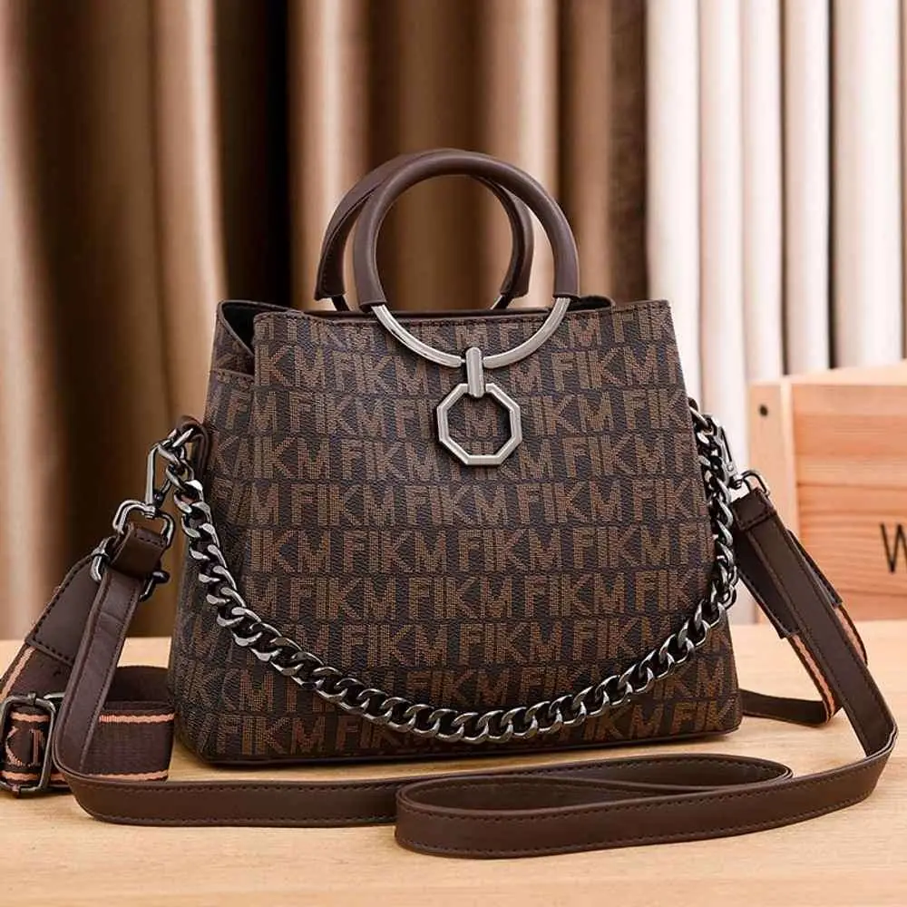 Front view of the RuSu Luxury Portable Women Bag in rich coffee brown, structured design. - thumbnail