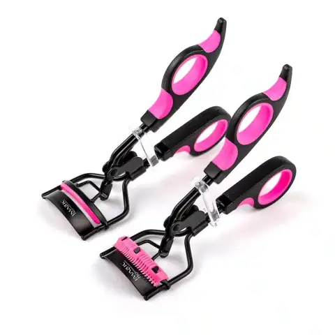 Imagic silver metallic eyelash curler with soft black silicone pads, ready for use on lashes.