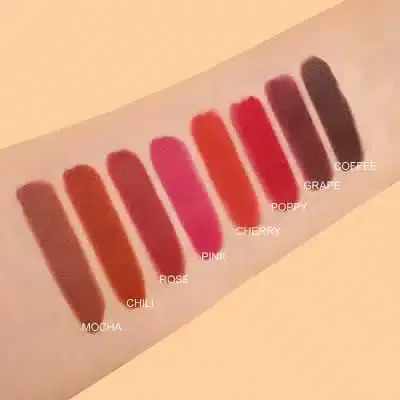 Imagic matte lipstick palette opened on a table with other beauty products. - thumbnail