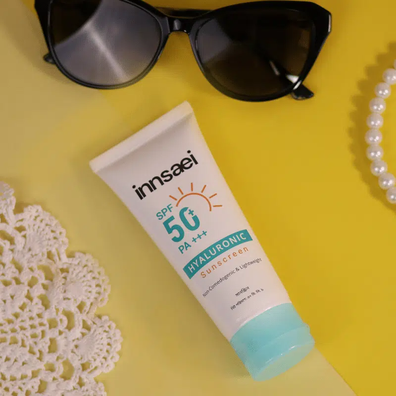 Back of Innsaei Hyaluronic Sunscreen SPF 50+ PA+++ tube, lying horizontally, showing ingredients. - thumbnail