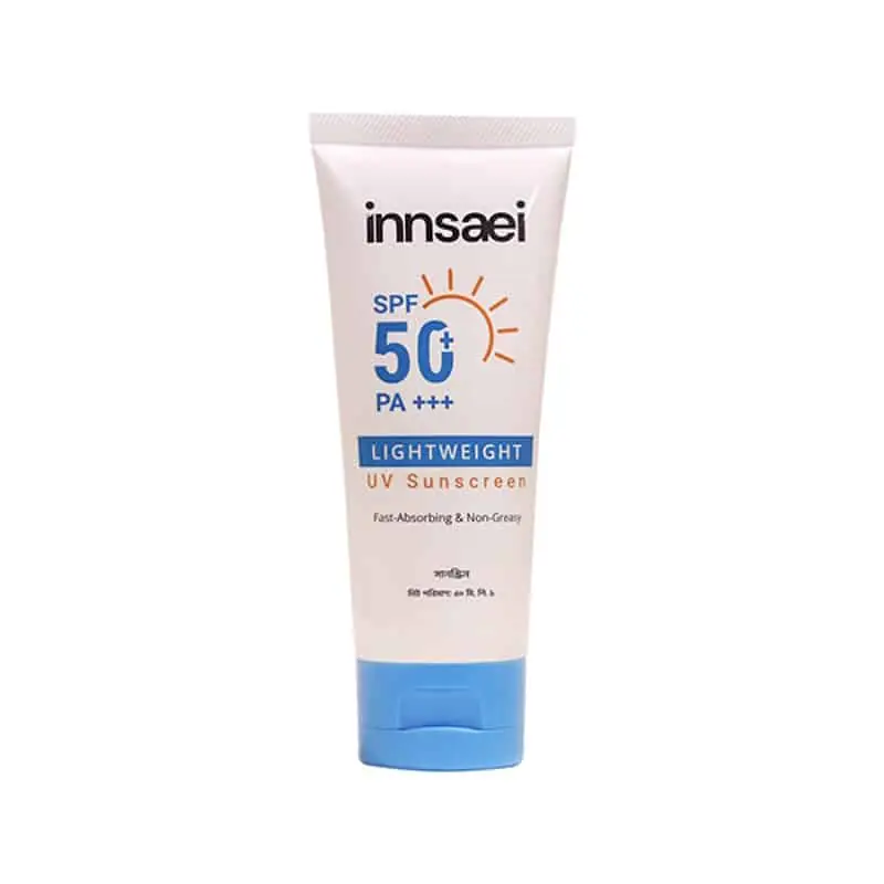 Innsaei Lightweight UV Sunscreen SPF 50+ PA+++ white tube lying horizontally, hand visible. - thumbnail
