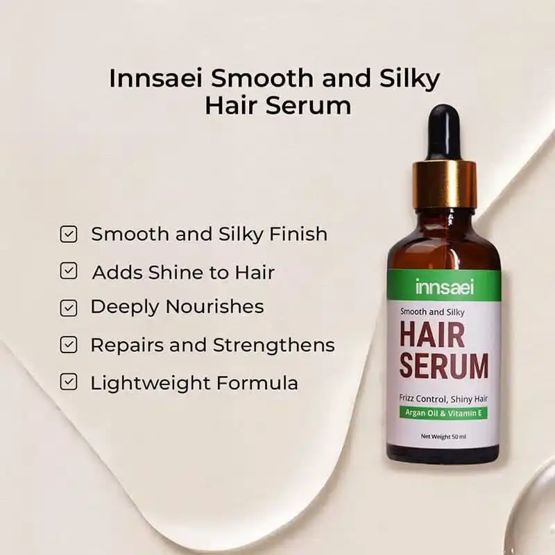 Clear Innsaei Smooth and Silky Hair Serum drop visible on a fingertip from pump. - thumbnail