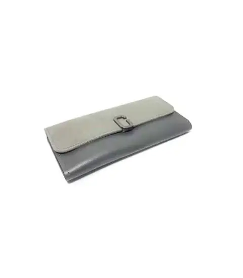 RuSu black minimalist iPhone dock with a white iPhone plugged in, ready for charging.