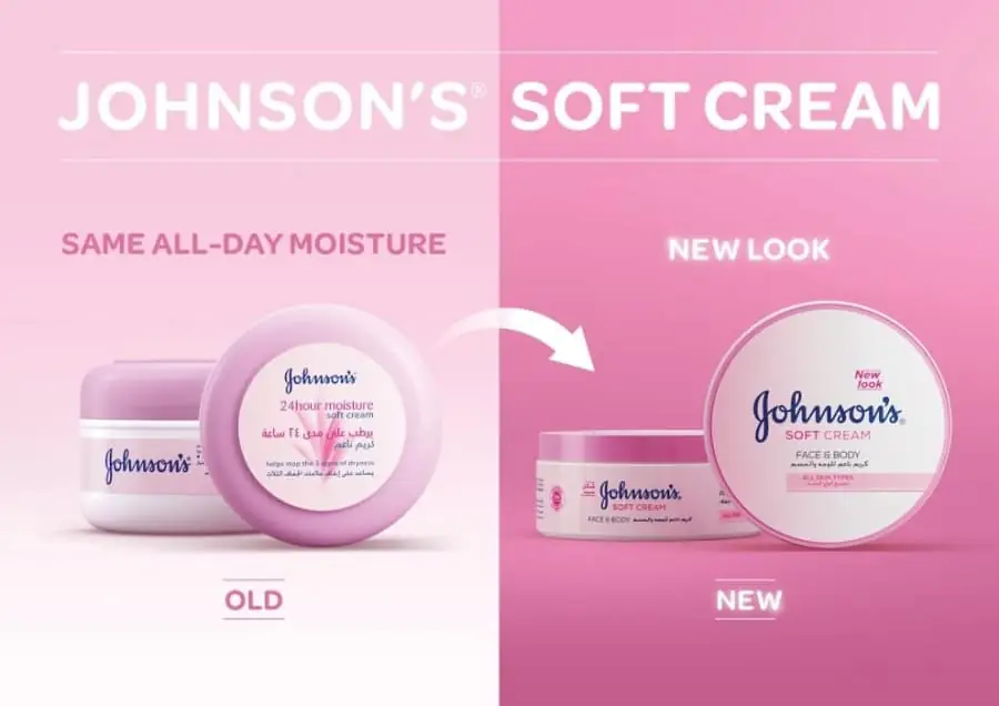 Johnson's Soft Cream open tub, showing white, smooth texture and a finger applying. - thumbnail