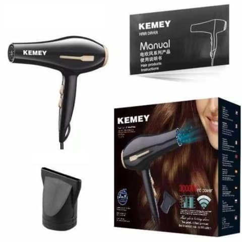 Kemey 2-in-1 black hot air brush hair dryer and styler with rose gold bristles.