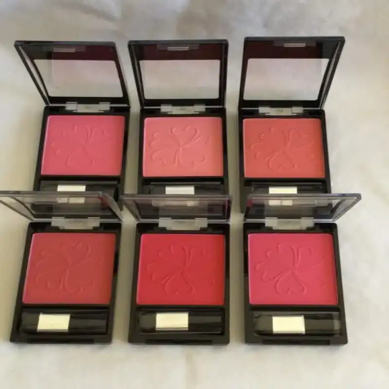 La Femme pressed powder blusher compact, open, revealing rosy pink shade and applicator brush. - thumbnail