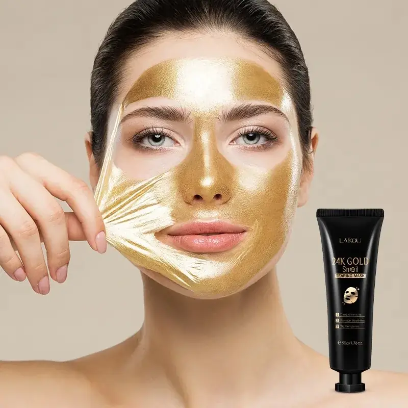 Laikou 24k Gold Tearing Mask tube lying beside a gooey, shiny golden mask application. - thumbnail