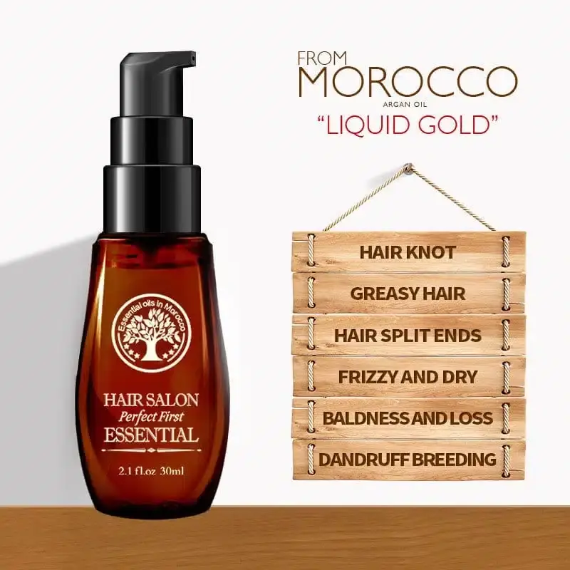 Laikou Morocco Essential Oil drops dispensed on a hand, showing the clear nourishing hair serum texture. - thumbnail